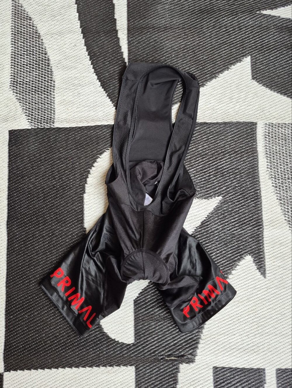 Black Cycling Bib Shorts with Red 'PRIMA' Branding